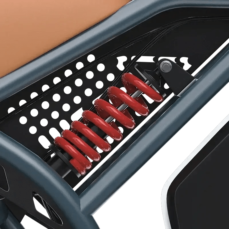 Close-up of red coil spring shock absorber in black and gray electric bike frame